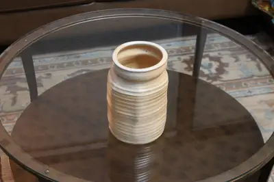 Pale ribbed jar. Tall jar with pale glaze over throwing ribs.