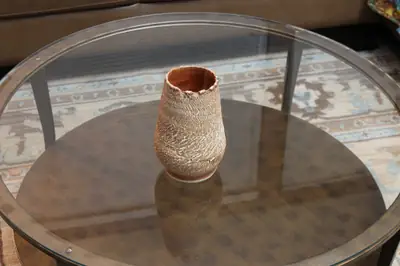 Textured series: orange-lined vase. Textured vase with an orange interior.