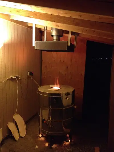 First firing in the shed. The updraft kiln firing under its new vent hood.