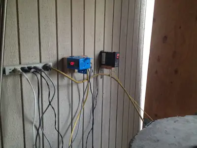 Controls. Temperature controllers mounted on the wall.