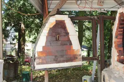 The old door. The door bricked up by hand before every firing.
