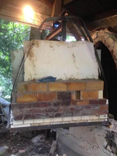 Door rising. The brick door taking shape in the frame.
