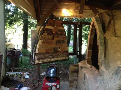 Finished door, wide. The door open beside the kiln arch.