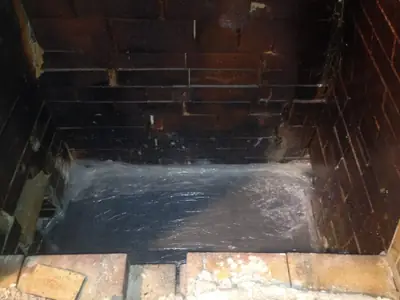 Inside the kiln. The kiln floor and walls, glazed by years of soda.